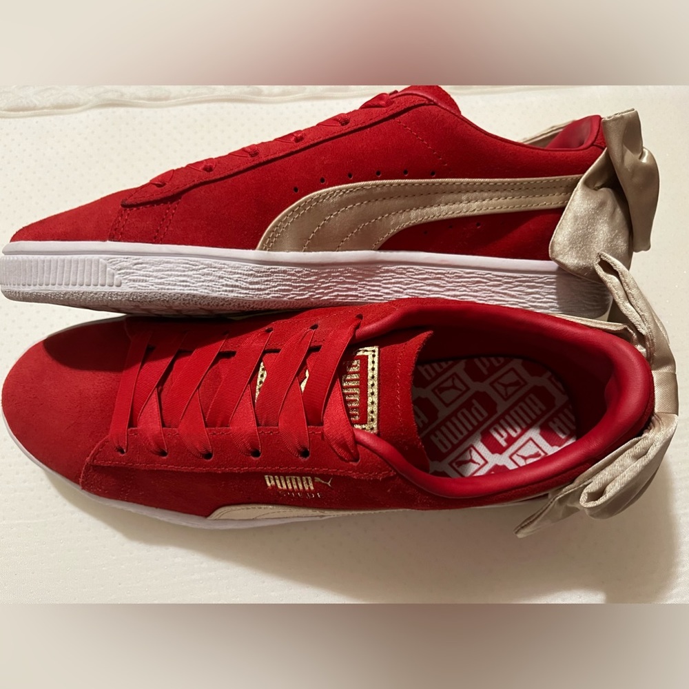 New! Adorable sure Pumas w gold bows! $55 Women’s size 7.5